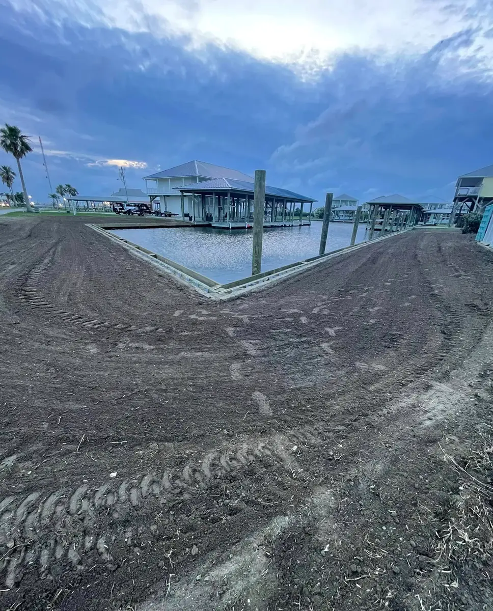 Graded waterfront building pad beside the boat docks