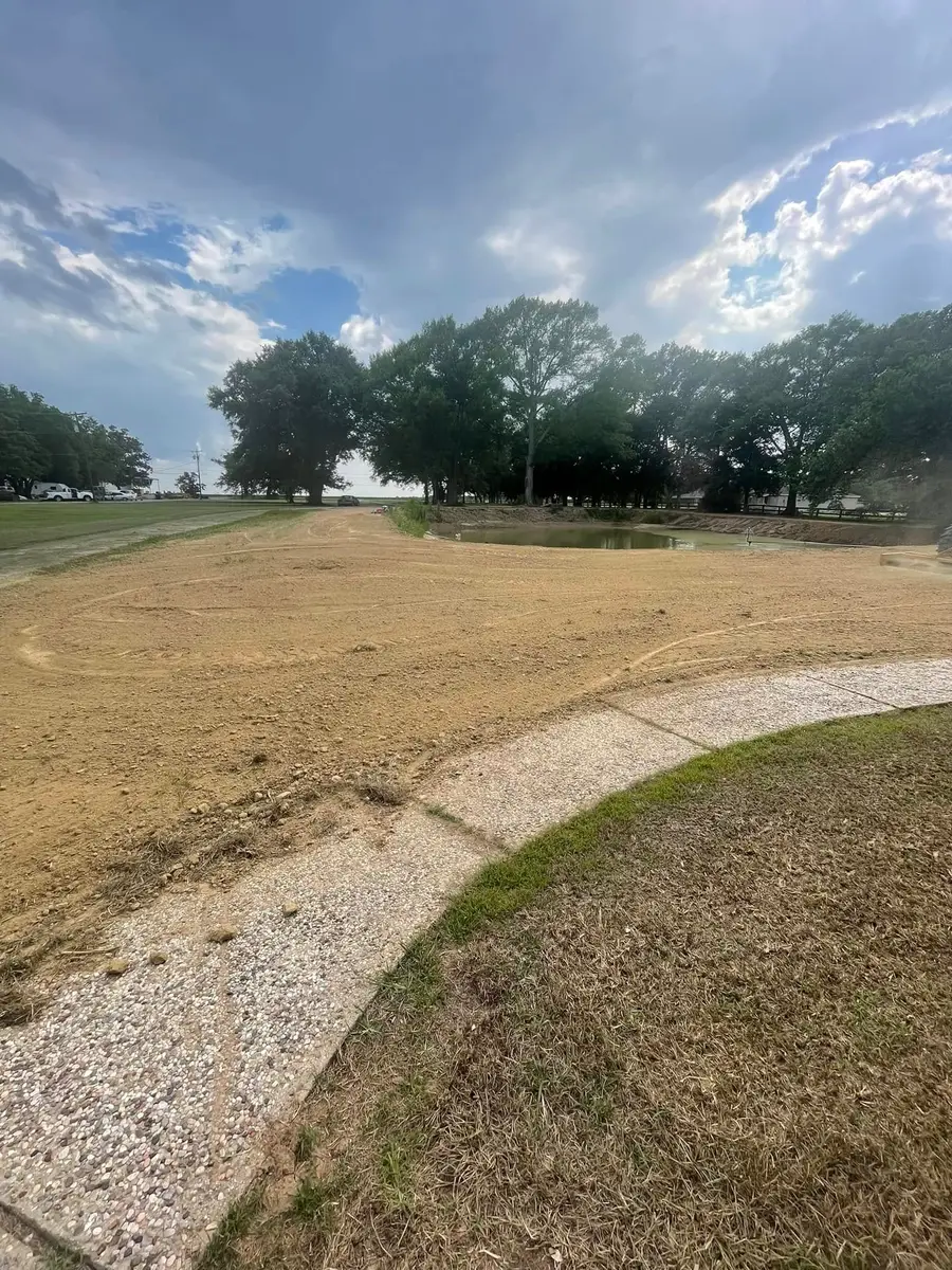Leveled site with a newly shaped pond