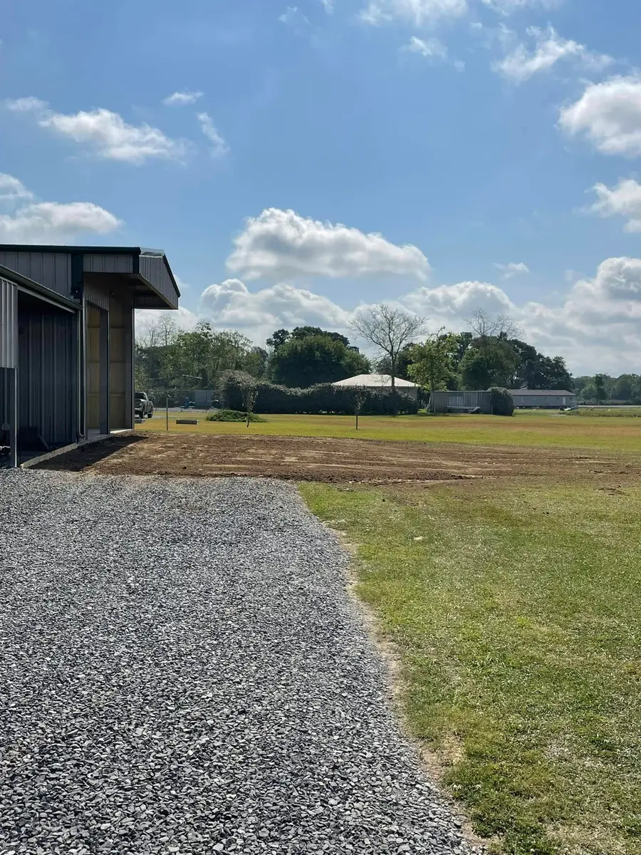 Graded pad beside a metal building